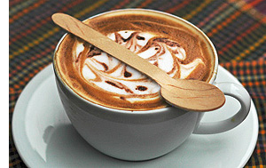 wooden spoon on coffee cup
